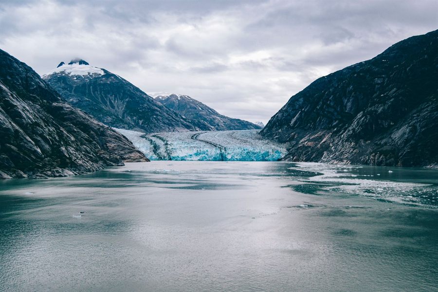 Glacier at the head of a steep-sided Alaska fjord